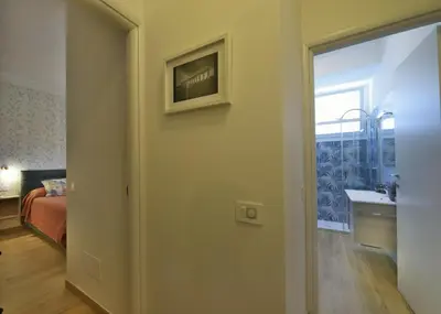 a room with a door to a bedroom with a bed at Joyful escape flat in Rome