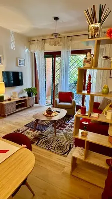 a living room with a couch and a table at Joyful escape flat in Rome