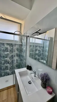 a bathroom with a sink and a mirror at Joyful escape flat in Rome