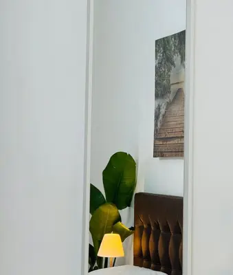 a door leading into a living room with a couch at Ayan Guest House in Rome