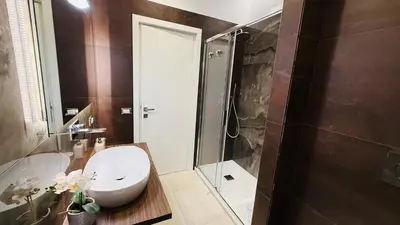 a bathroom with a toilet and a shower at Apartmentdigioia in Rome