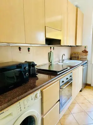 a kitchen with a microwave oven and a sink at Casa San Pietro Rome Vatican in Rome