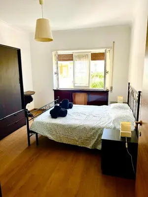 a bedroom with a bed and a window at Charming apartment Eur in Rome