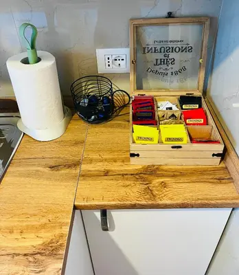 a wooden table with books on top of a counter at Charming apartment Eur in Rome