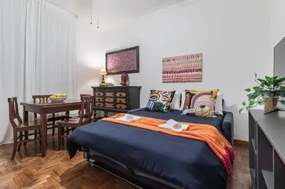 a bedroom with a bed and a desk and a table at San Giovanni Metro A Cozy Suite WIFI AC in Rome
