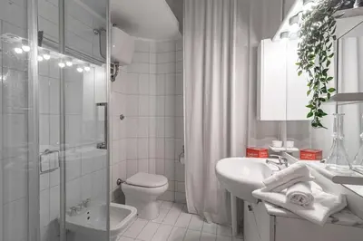 a bathroom with a sink toilet and a shower at San Giovanni Metro A Cozy Suite WIFI AC in Rome