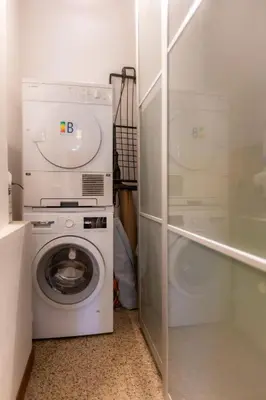 a laundry room with a washing machine and a washer at Romano Apartments - 