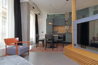 a living room with a television and a dining room at Onofrio in Rome