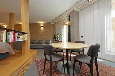 a living room with a table and chairs and a couch at Onofrio in Rome