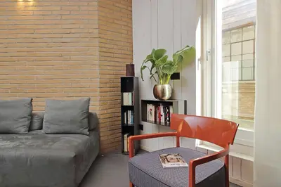 a living room with a couch and a chair at Onofrio in Rome
