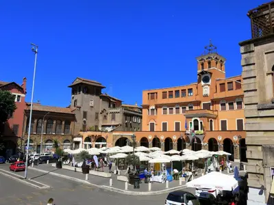 a group of buildings with umbrellas and a clock tower at Residenza Cimone in Rome