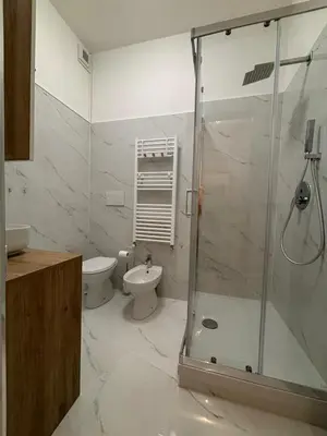 a bathroom with a shower and a toilet and a sink at Inn Rhome 71 in Rome