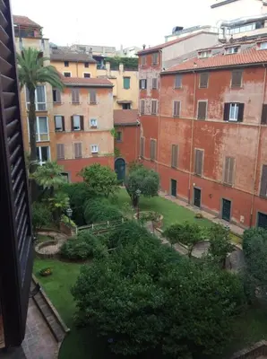 a view of a garden in a city with buildings at Roberta Apartment Fontana di Trevi in Rome