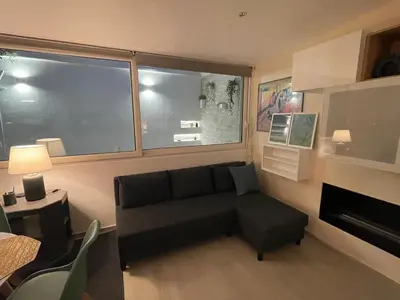 a living room with a couch and a fireplace at Divine Terrace Stylish Apartment St Peter Rome in Rome