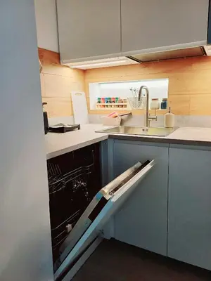 a kitchen with a sink and a dishwasher at Divine Terrace Stylish Apartment St Peter Rome in Rome