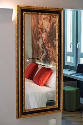 a picture of a painting of a bed with pillows at Dreamers in Belsiana Condotti Int 9 in Rome
