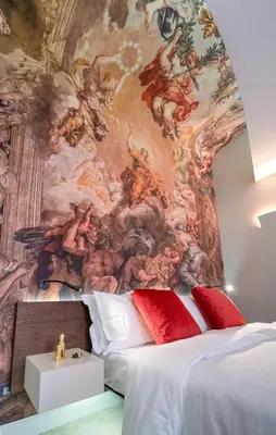a bedroom with a painting on the wall at Dreamers in Belsiana Condotti Int 9 in Rome