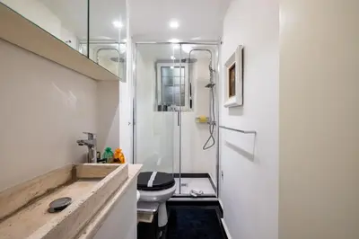 a bathroom with a sink and a toilet and a shower at Elegant Studio in the Center in Rome