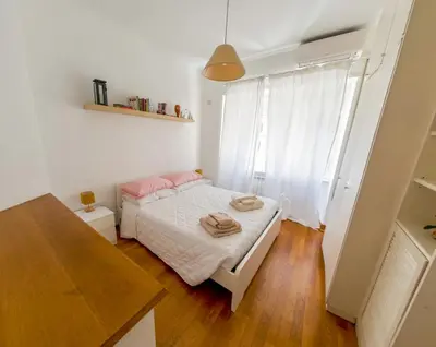 a small bedroom with a bed and a window at Central Boutique Apartment for2 in Rome
