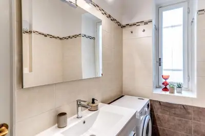 a bathroom with a sink and a mirror at Apartment near Via Veneto in Rome