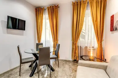 a living room with a table and a couch at Apartment near Via Veneto in Rome