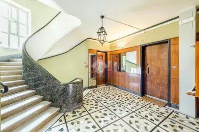 a home with a spiral staircase in a hallway at Your window on San Pietro in Rome