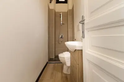a bathroom with a toilet and a sink at Elegant suite in Prati, 5 minutes from the Vatican in Rome