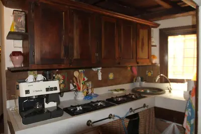 a kitchen with a coffee maker on the counter at Campo dei Fiori Jewel in Rome