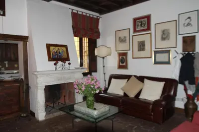 a living room with a couch and a fireplace at Campo dei Fiori Jewel in Rome