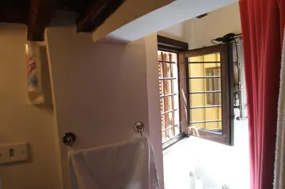a bathroom with a window and a towel at Campo dei Fiori Jewel in Rome