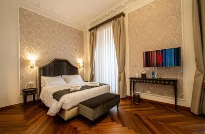 a hotel room with a bed and a window at L'Angolo Sereno Guesthouse Rome Termini in Rome