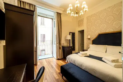 a bedroom with a large bed and a window at L'Angolo Sereno Guesthouse Rome Termini in Rome