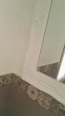a mirror on the ceiling of a room with a tile floor at A Casetta Nostra in Rome