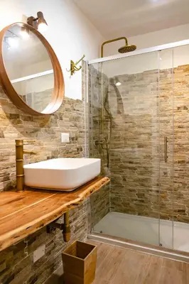 a bathroom with a sink and a shower at ColosseoHome in Rome
