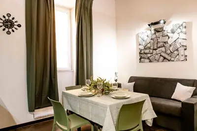 a living room with a table and a couch at ColosseoHome in Rome