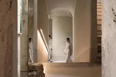 a group of people standing in a hallway at Nomos Hotel in Rome