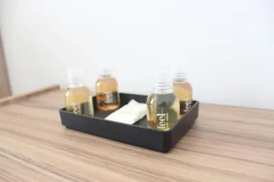 a tray with four bottles of alcohol on a wooden floor at Relais Monteverde in Rome