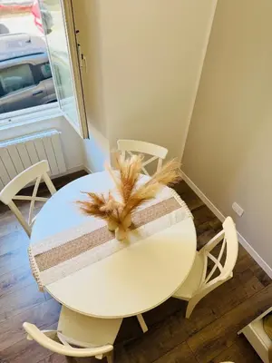 a white table with a towel on top of it at Seiemme Colosseo Luxury Apartment 2 in Rome