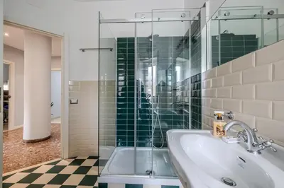 a bathroom with a sink and a glass shower at Star Guest House Rome in Rome