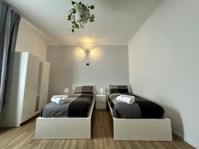 a bedroom with two beds in a room at Roma San Pietro alloggio turistico Casa Patrizia in Rome
