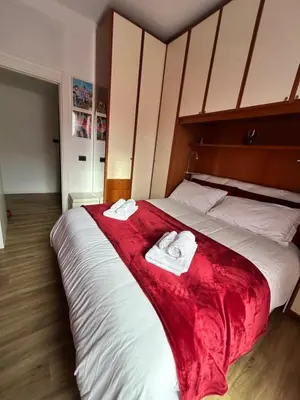 a bedroom with a bed with two towels on it at Roma San Pietro alloggio turistico Casa Patrizia in Rome