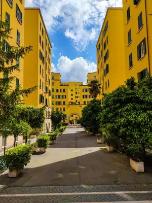 an empty street in a yellow building at Re di Room in Rome