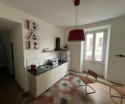 a kitchen with a sink and a microwave in it at Quattro fiori apartment in Rome