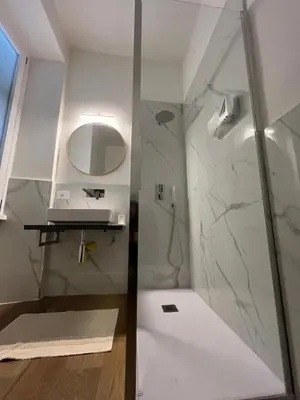 a bathroom with a shower and a sink at Quattro fiori apartment in Rome