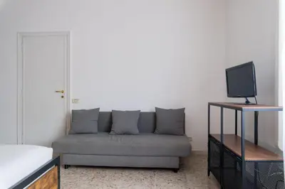 a living room with a couch and a tv at Katia House in Rome