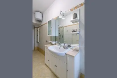 a bathroom with a sink and a mirror at Katia House in Rome