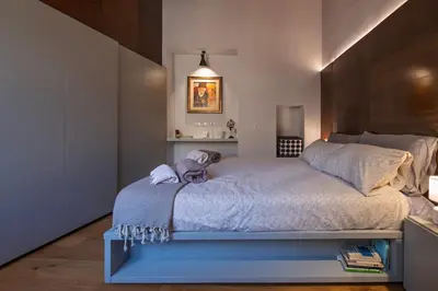 a bedroom with a large bed in a room at Giulia's House, Monti in Rome