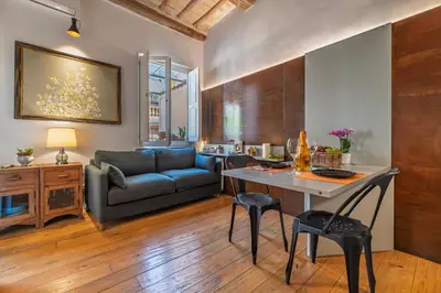 a living room with a couch and a table at Giulia's House, Monti in Rome