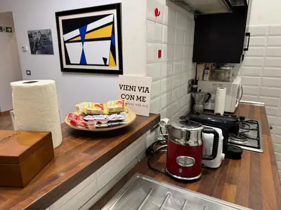a counter in a kitchen with a plate of food at All Suite Colosseo in Rome
