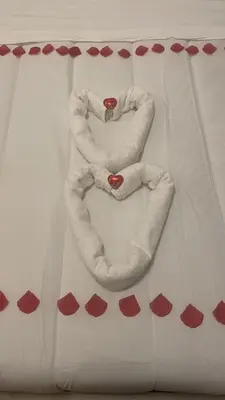 a number made out of white towels on a table at All Suite Colosseo in Rome